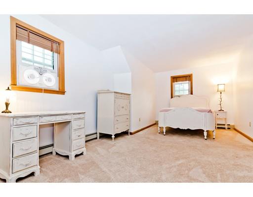 225 Locke Road Ashby, MA 01431 - Photo 13 of 27 a spacious bedroom with a bed and a cabinets