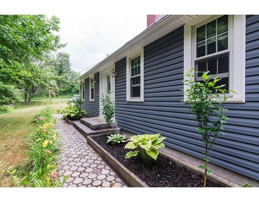 225 Locke Road Ashby, MA 01431 - Photo 22 of 27 a front view of a house with a yard
