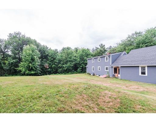 225 Locke Road Ashby, MA 01431 - Photo 26 of 27 a view of an house with backyard and bushes
