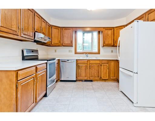 225 Locke Road Ashby, MA 01431 - Photo 4 of 27 a kitchen with stainless steel appliances granite countertop a refrigerator sink and cabinets