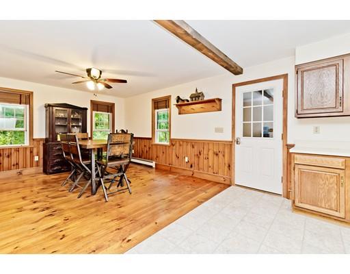 225 Locke Road Ashby, MA 01431 - Photo 5 of 27 a living room with furniture a dining table and a large window