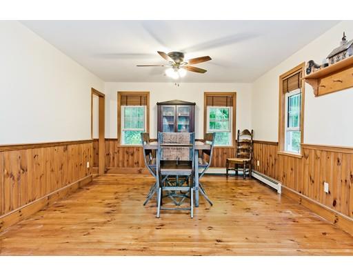 225 Locke Road Ashby, MA 01431 - Photo 6 of 27 a living room with furniture a large window and wooden floor
