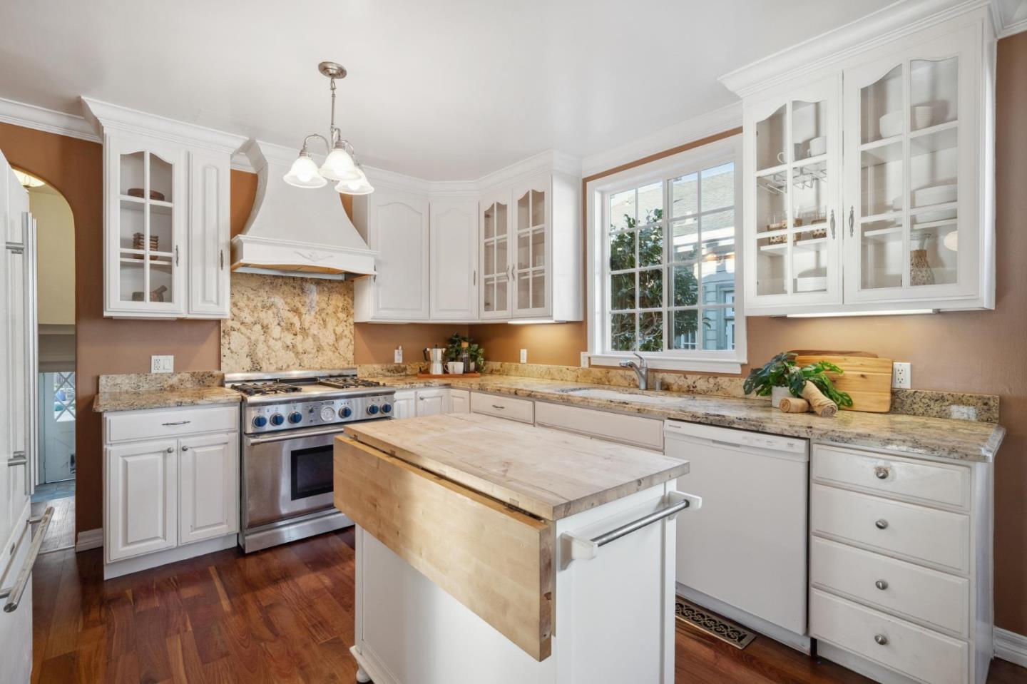 1204 Edgehill Drive Burlingame, CA 94010 - Photo 14 of 38 a kitchen with a stove a sink and a refrigerator
