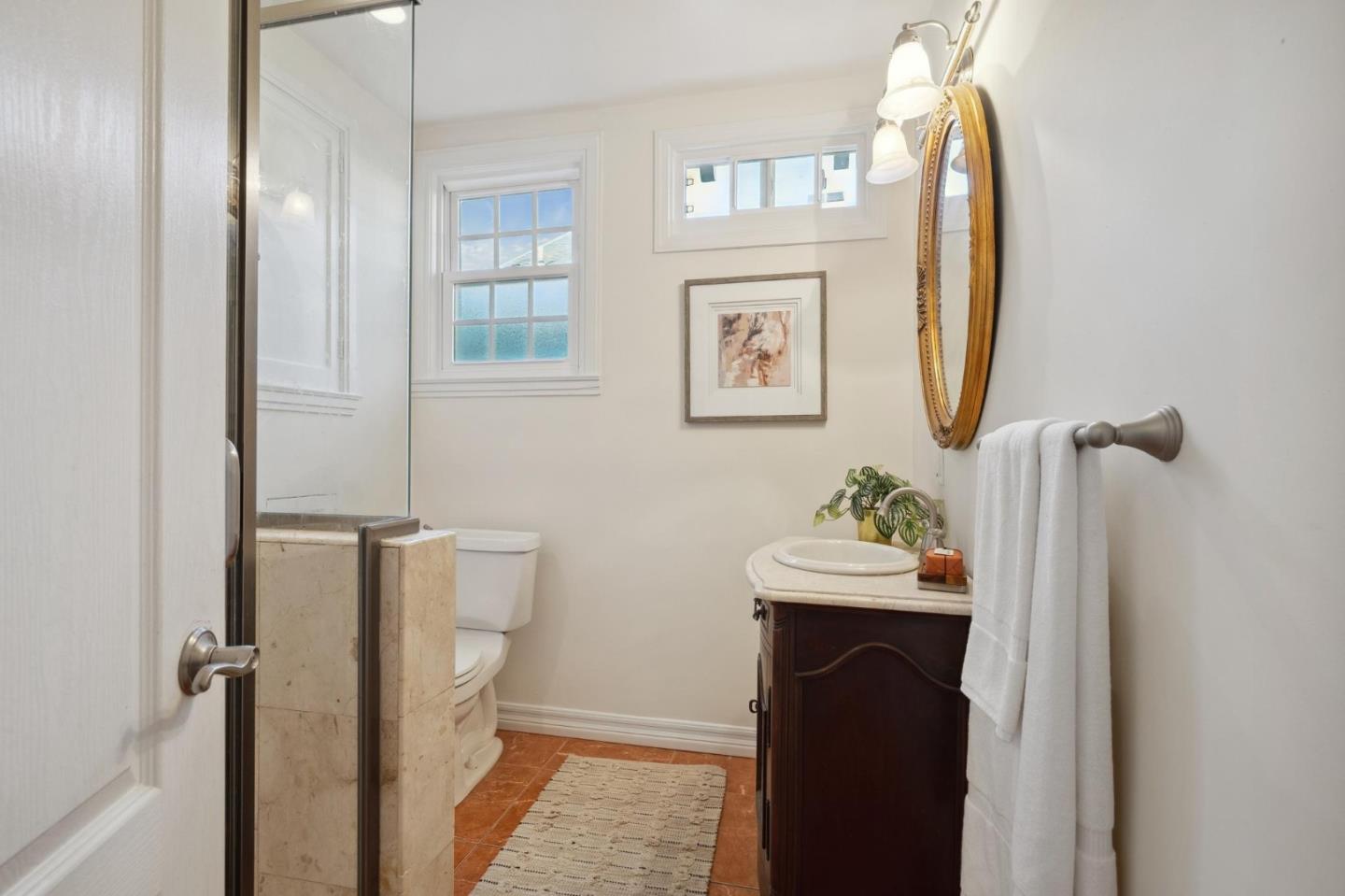 1204 Edgehill Drive Burlingame, CA 94010 - Photo 15 of 38 a bathroom with a sink and a mirror