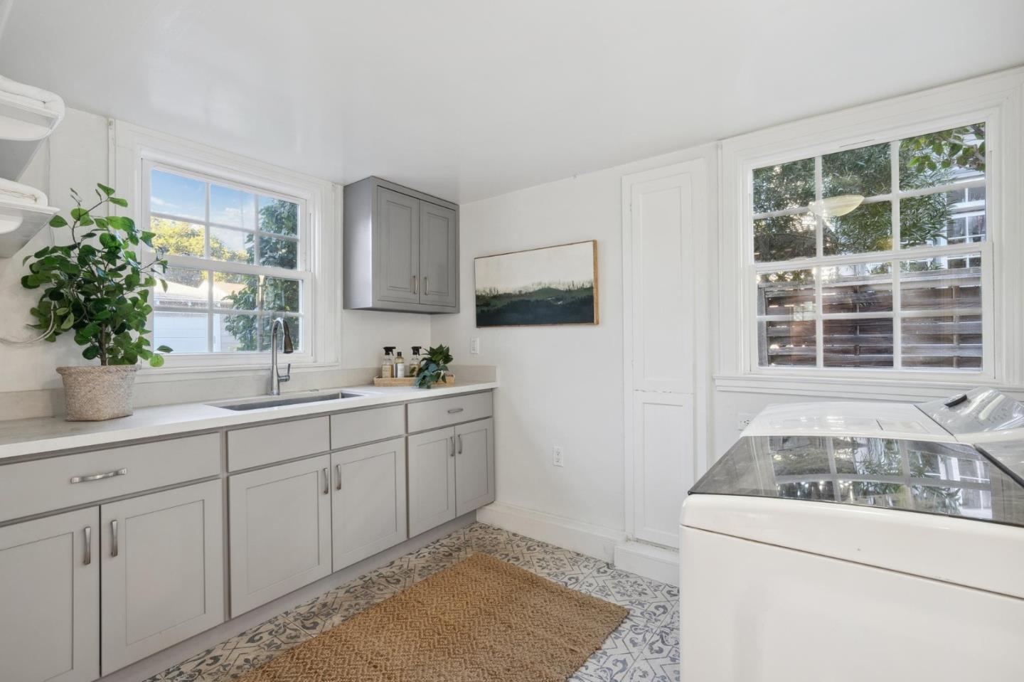 1204 Edgehill Drive Burlingame, CA 94010 - Photo 22 of 38 a view of a sink and dishwasher with wooden floor
