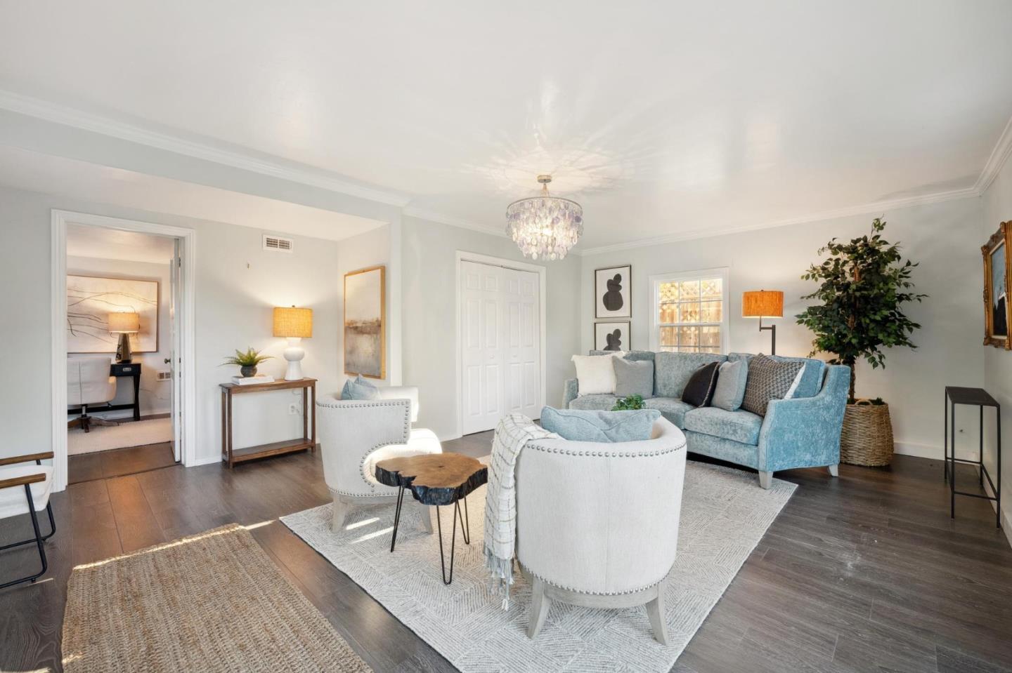 1204 Edgehill Drive Burlingame, CA 94010 - Photo 27 of 38 a living room with furniture and a chandelier