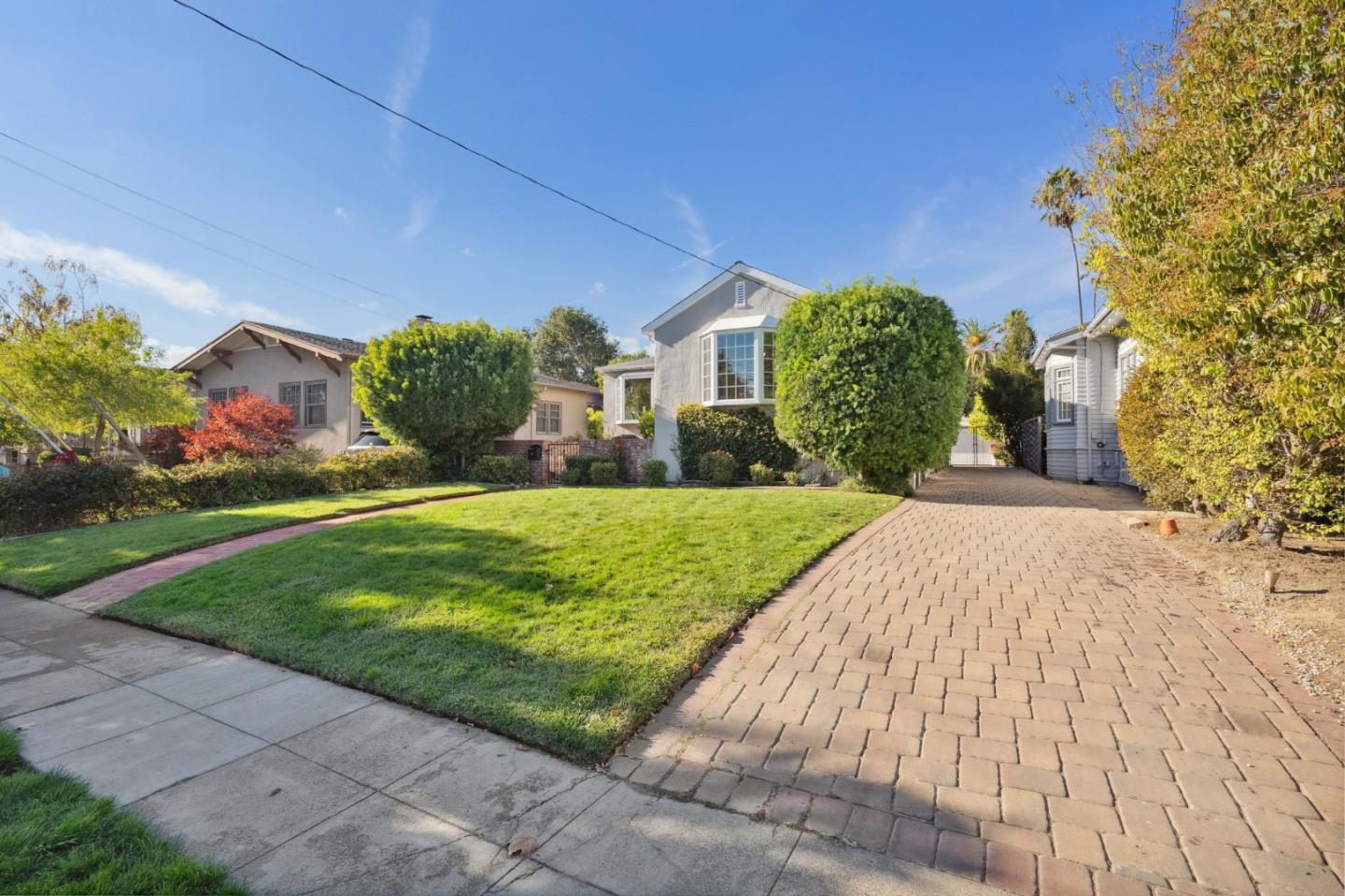 1204 Edgehill Drive Burlingame, CA 94010 - Photo 38 of 38 a front view of a house with a yard