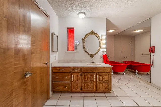 a view of a bathroom with a sink mirror vanity and toilet
