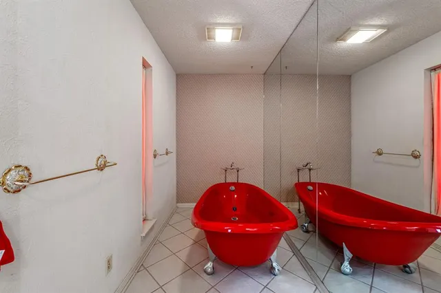 a bathroom with a granite countertop sink a toilet and a mirror