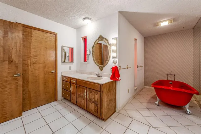 a bathroom with a sink vanity and a mirror