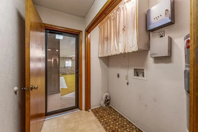 a view of an empty room with a garage