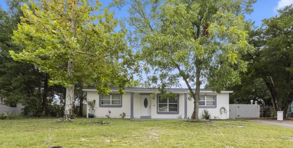 front view of a house with a yard