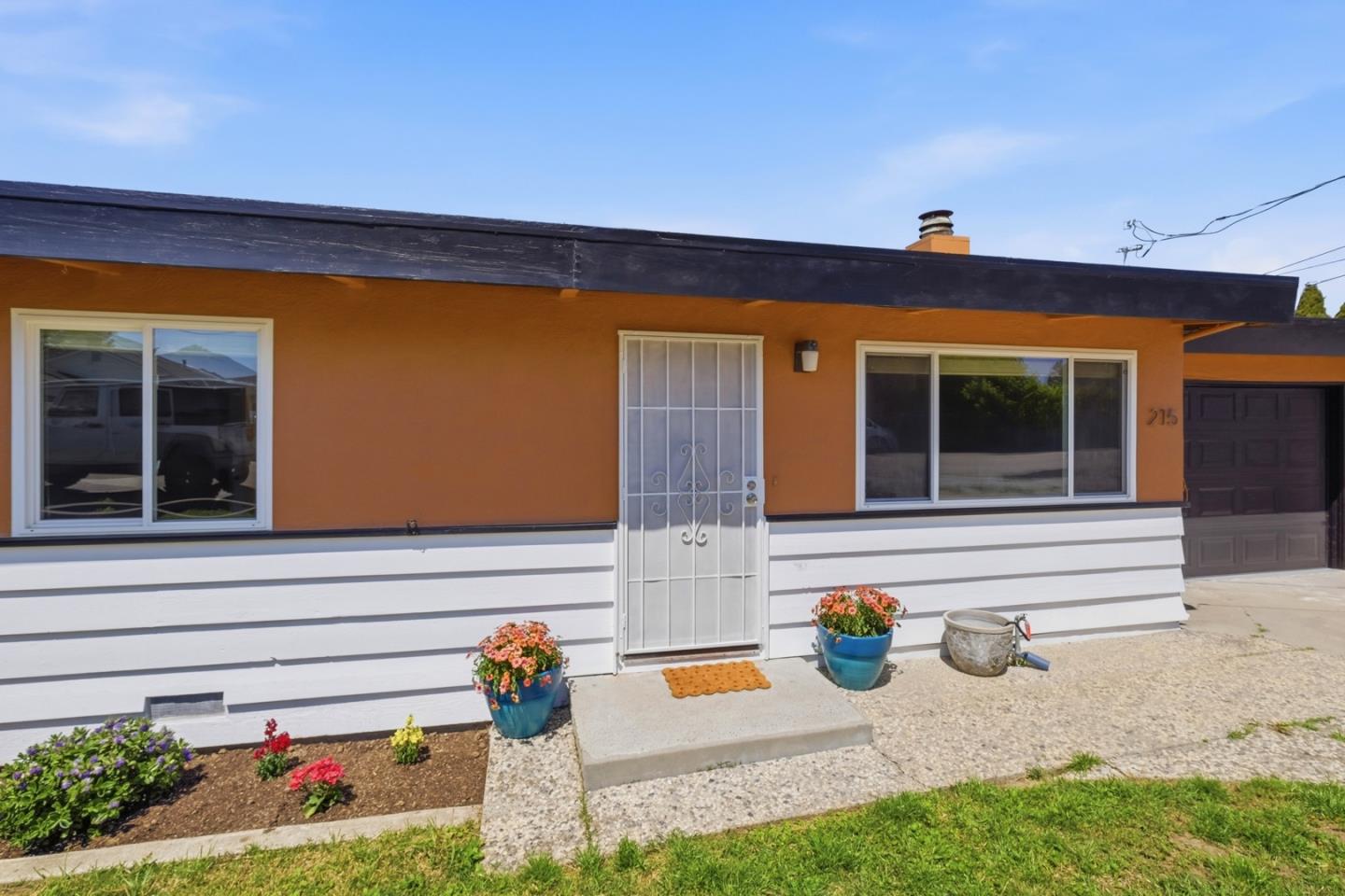 a outdoor view of a house with outdoor seating