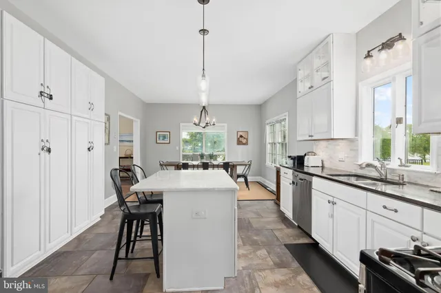 a kitchen with sink cabinets and window