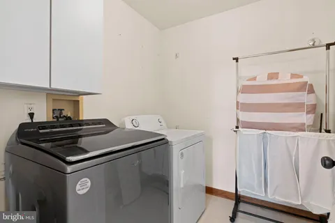 a stove top oven sitting inside of a kitchen