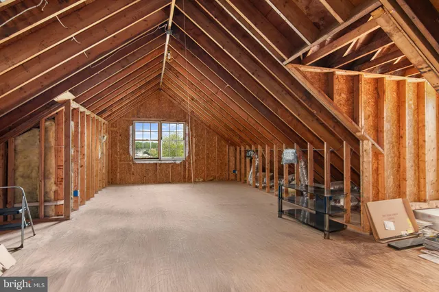 a view of a house with swimming pool and sitting area