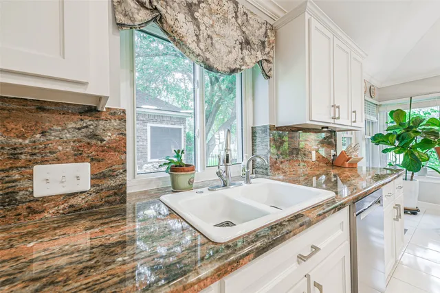 a view of living room with furniture and a potted plant