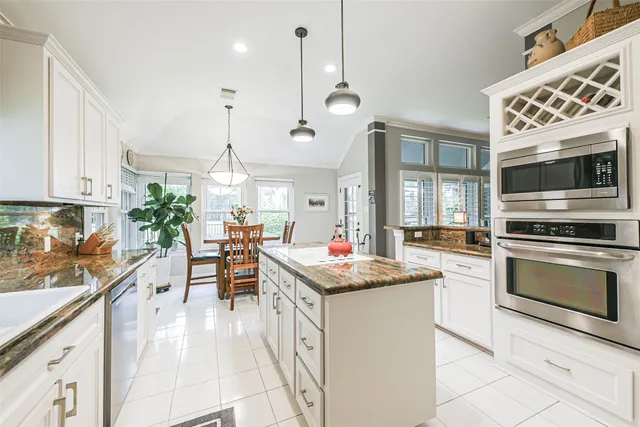 a kitchen that has a lot of cabinets in it
