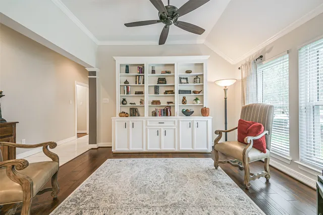 a living room with furniture or couch and a large window