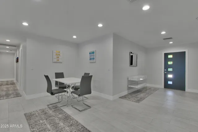 a view of work space with furniture and window