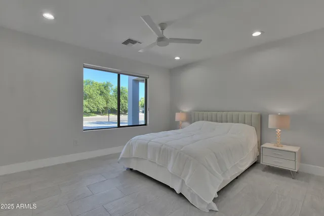a bedroom with a bed and window