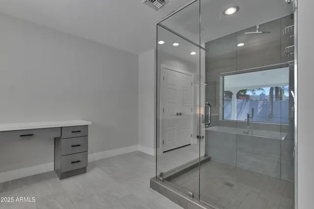 a view of work space with wooden floor and a rug