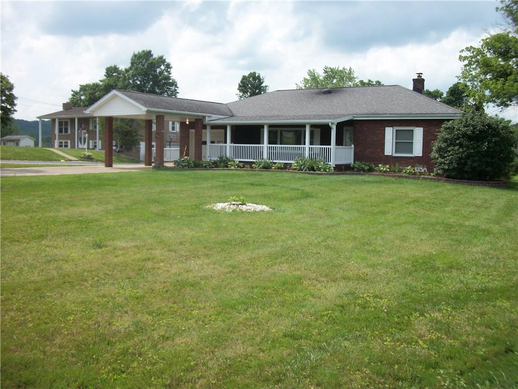 562 Old Waynesburg Road Carmichaels, PA 15320 - Photo 1 of 34 a front view of a house with a garden