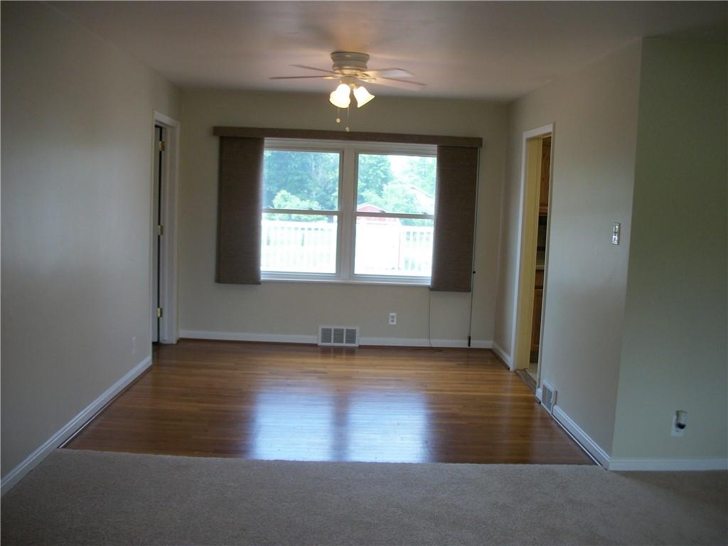 562 Old Waynesburg Road Carmichaels, PA 15320 - Photo 14 of 34 an empty room with wooden floor and windows
