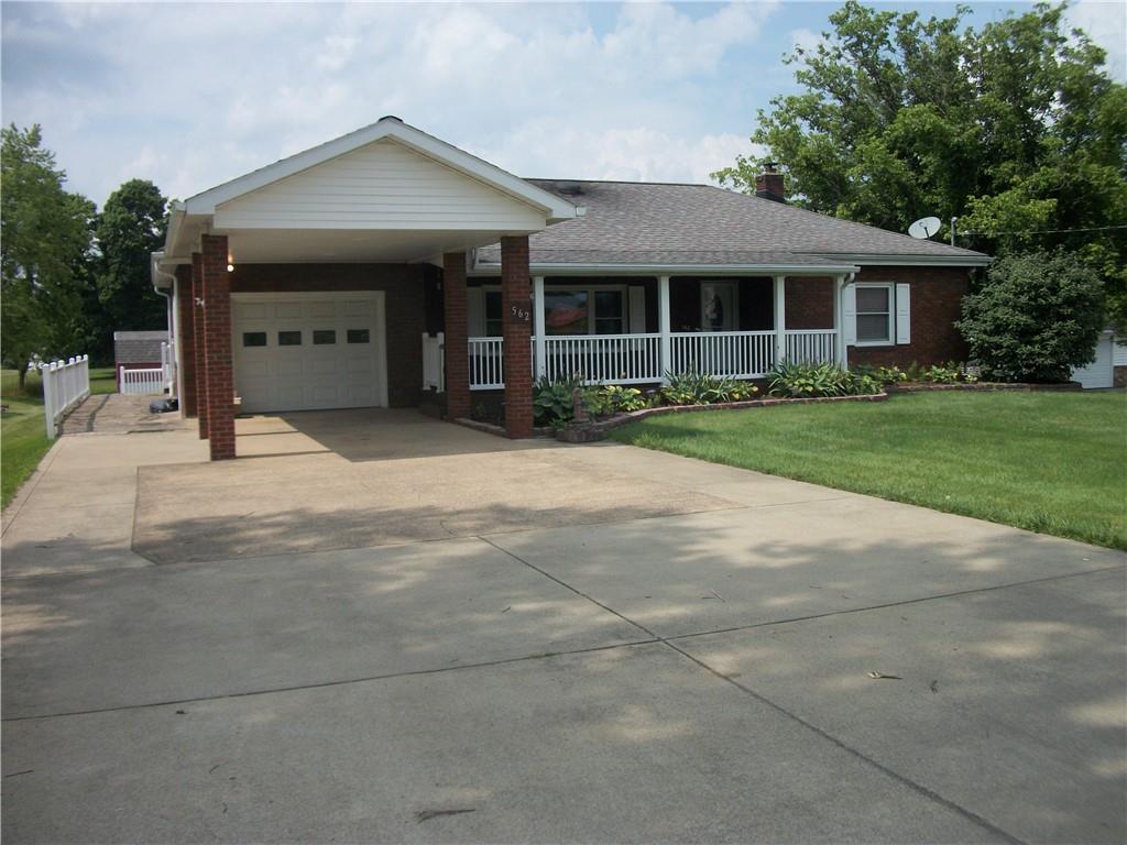 562 Old Waynesburg Road Carmichaels, PA 15320 - Photo 2 of 34 a front view of a house with a yard and garage