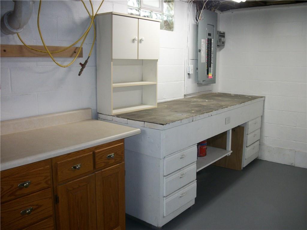 562 Old Waynesburg Road Carmichaels, PA 15320 - Photo 33 of 34 a utility room with cabinets and wooden floor