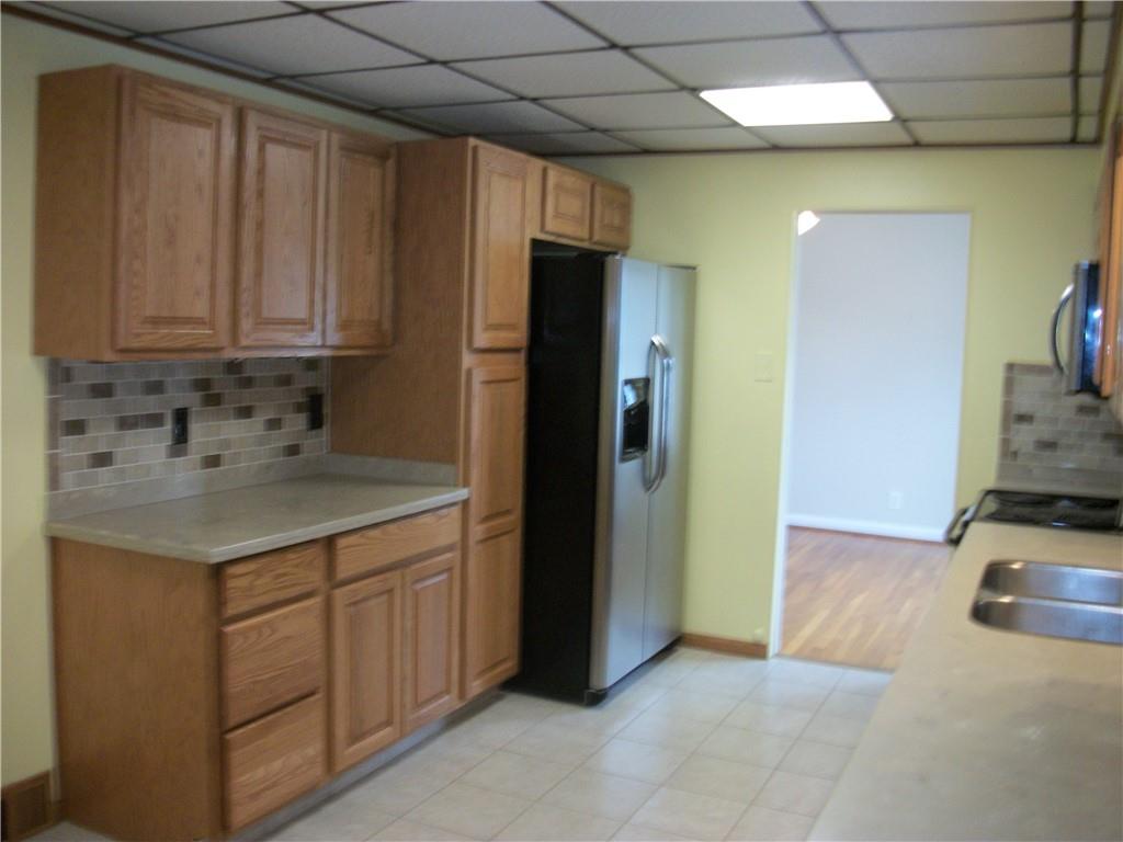 562 Old Waynesburg Road Carmichaels, PA 15320 - Photo 10 of 34 a kitchen with a sink and a refrigerator