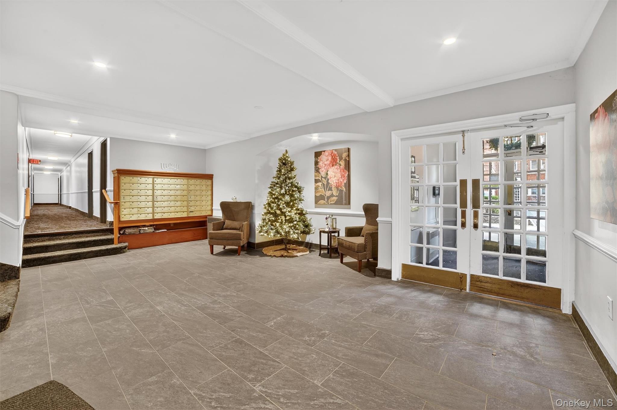 60 Locust Avenue, Unit 214A New Rochelle, NY 10801 - Photo 5 of 20 Sitting room with french doors, ornamental molding, recessed lighting, and beamed ceiling