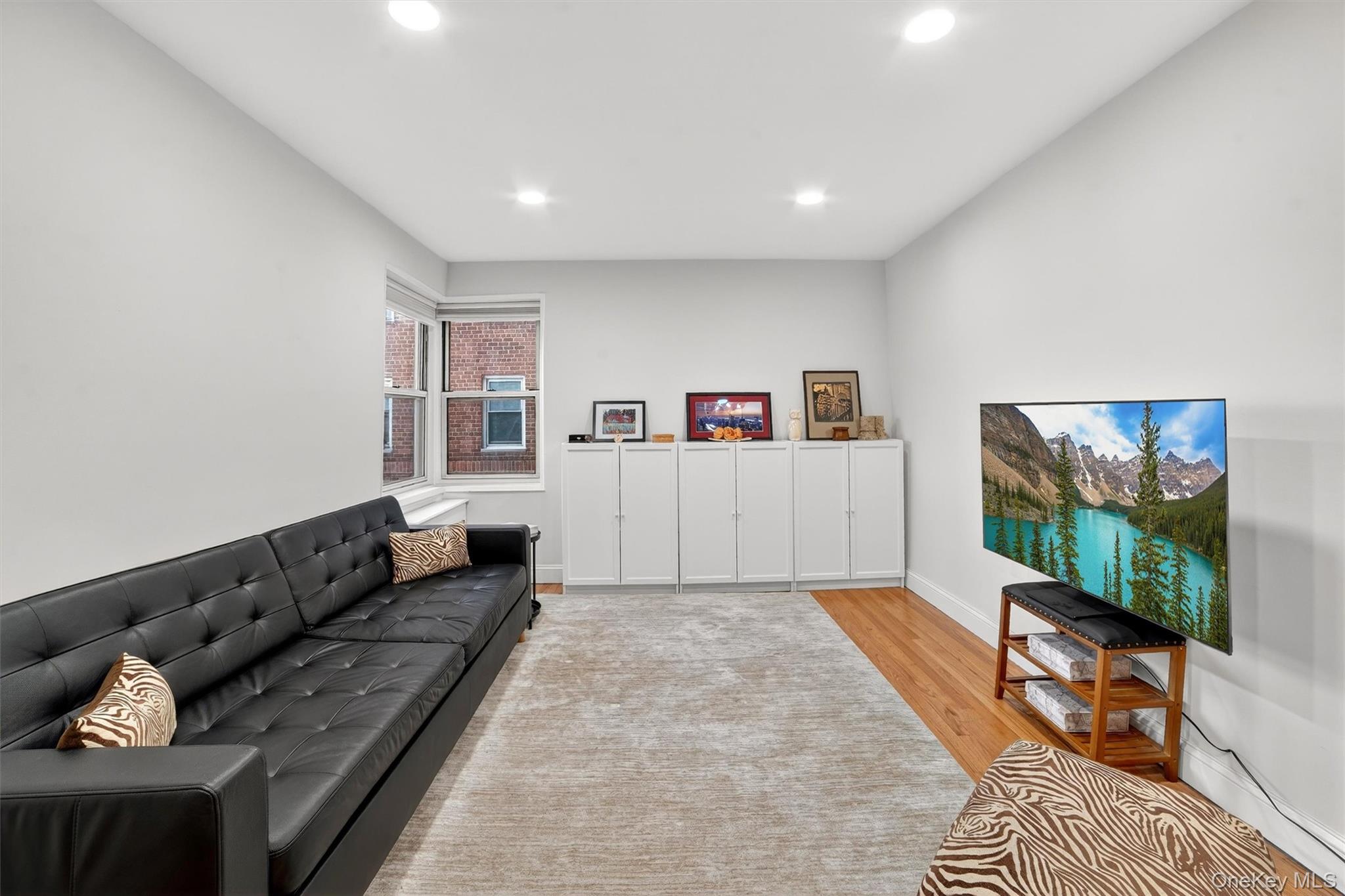 60 Locust Avenue, Unit 214A New Rochelle, NY 10801 - Photo 7 of 20 Living area with light wood-type flooring and recessed lighting