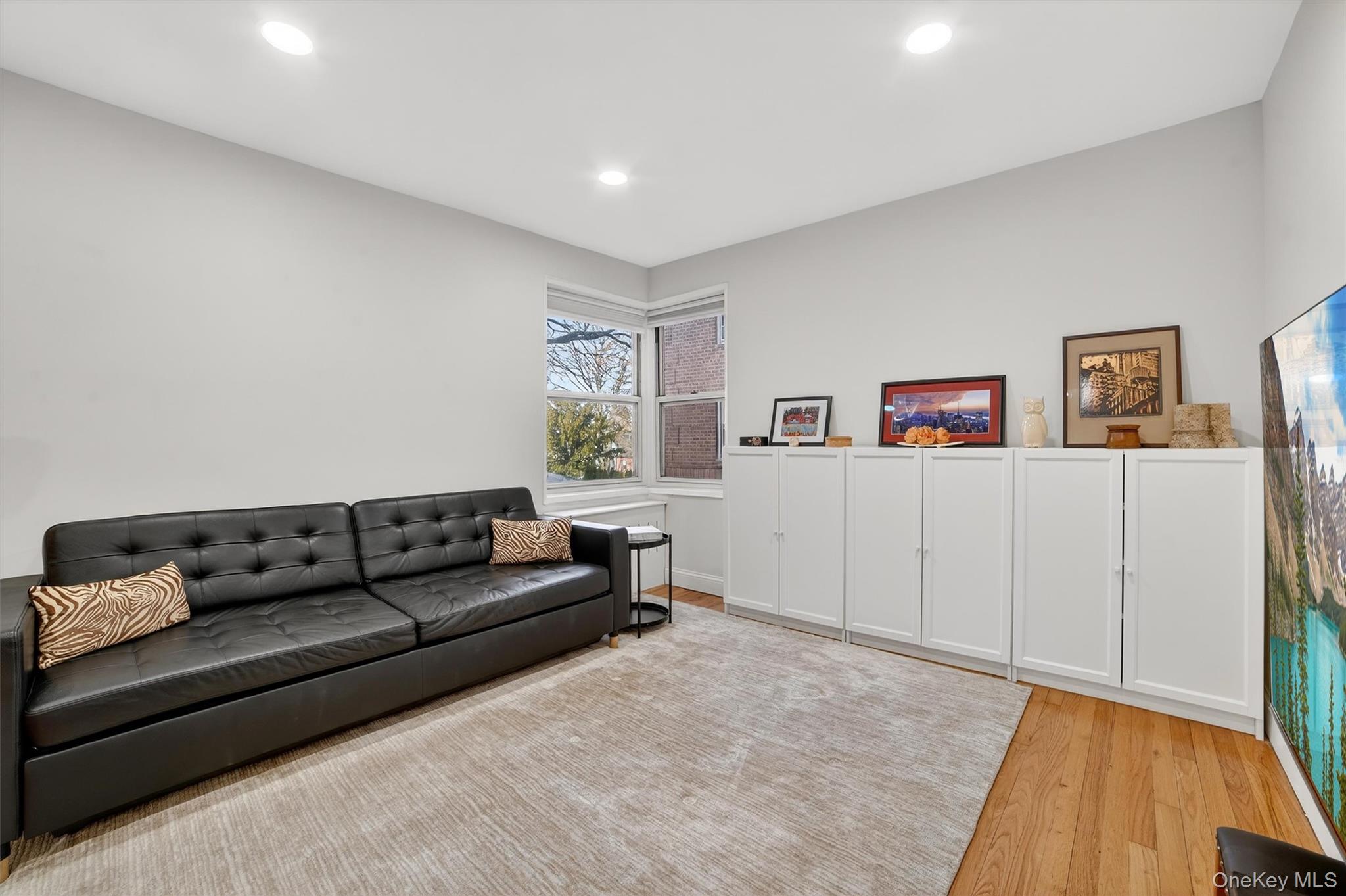 60 Locust Avenue, Unit 214A New Rochelle, NY 10801 - Photo 8 of 20 Living room featuring light wood-style floors and recessed lighting