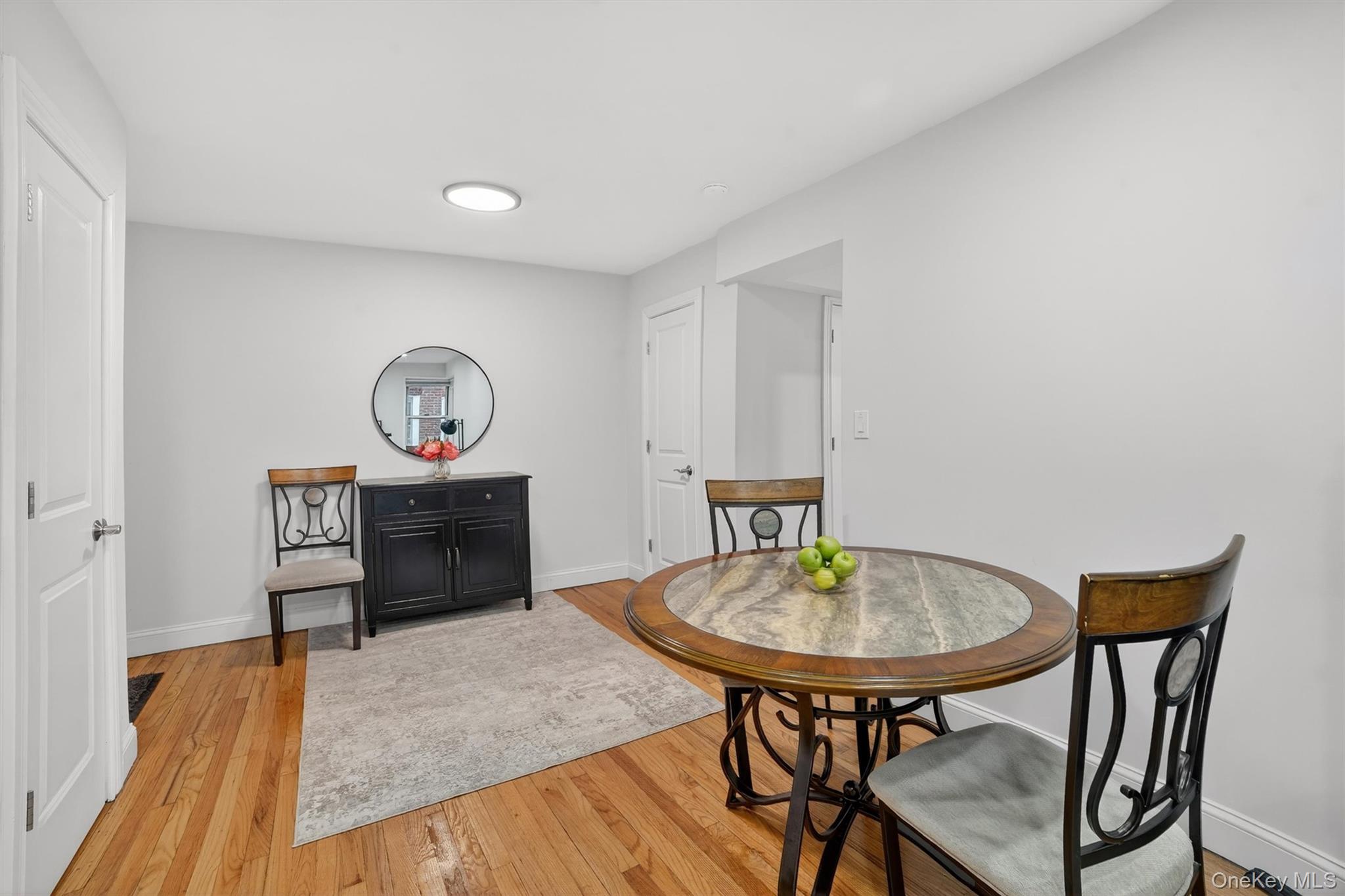 60 Locust Avenue, Unit 214A New Rochelle, NY 10801 - Photo 10 of 20 Dining area with light wood-style floors