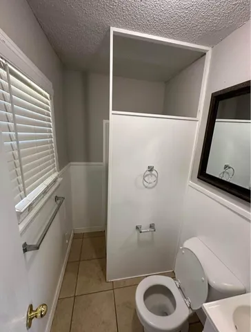 a bathroom with a toilet and a sink