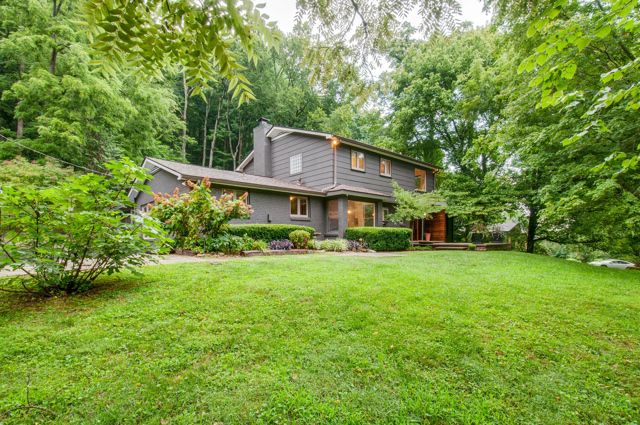 751 Rodney Drive Nashville, TN 37205 - Photo 2 of 50 a front view of a house with a yard