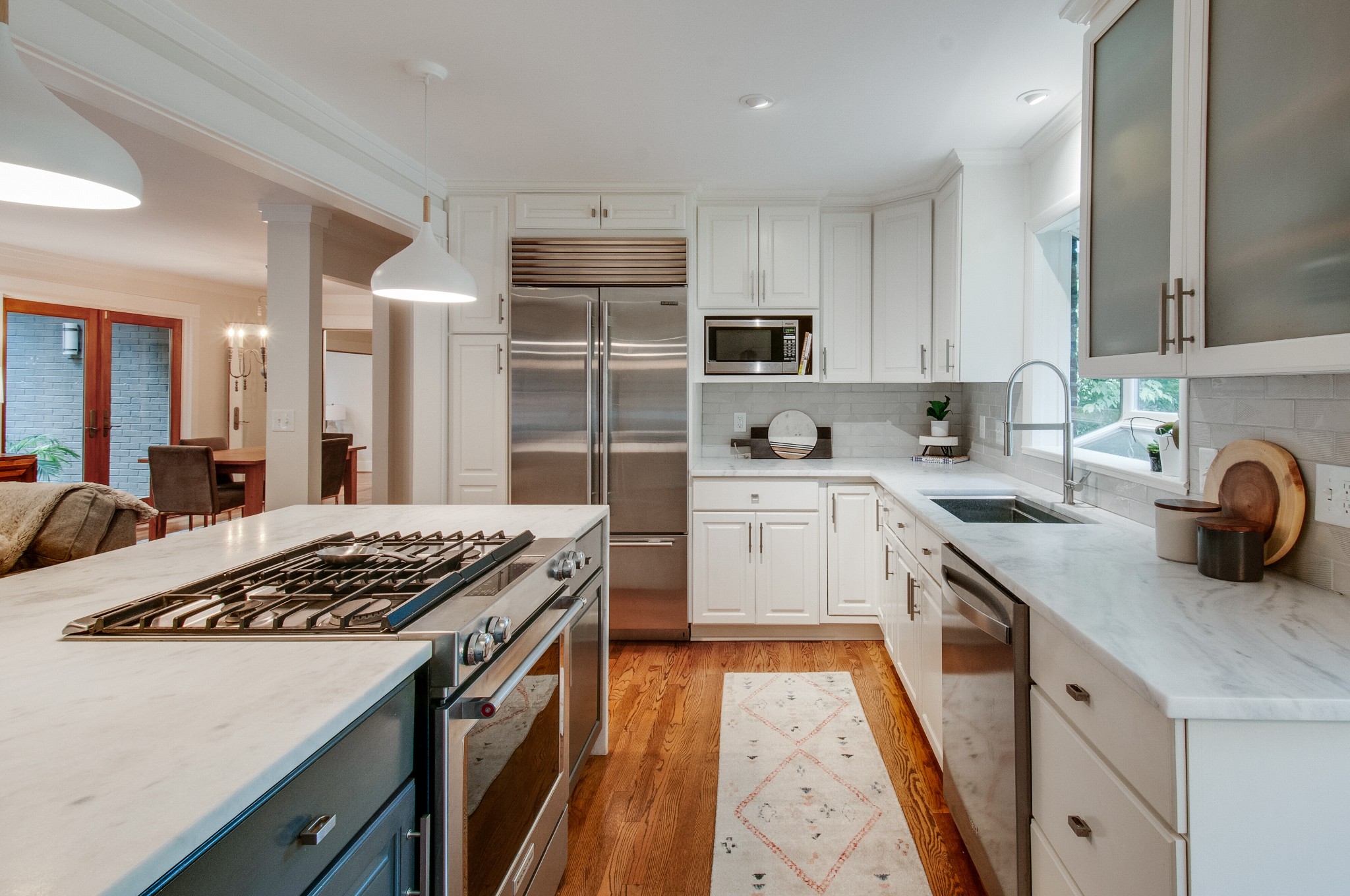 751 Rodney Drive Nashville, TN 37205 - Photo 15 of 50 a kitchen with a sink stove and refrigerator