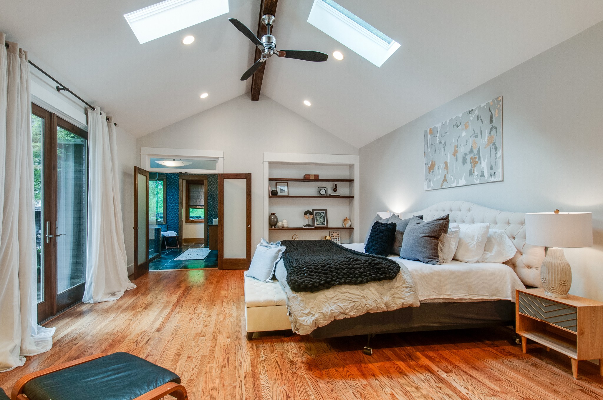 751 Rodney Drive Nashville, TN 37205 - Photo 18 of 50 a bedroom with a large bed and a wooden floor