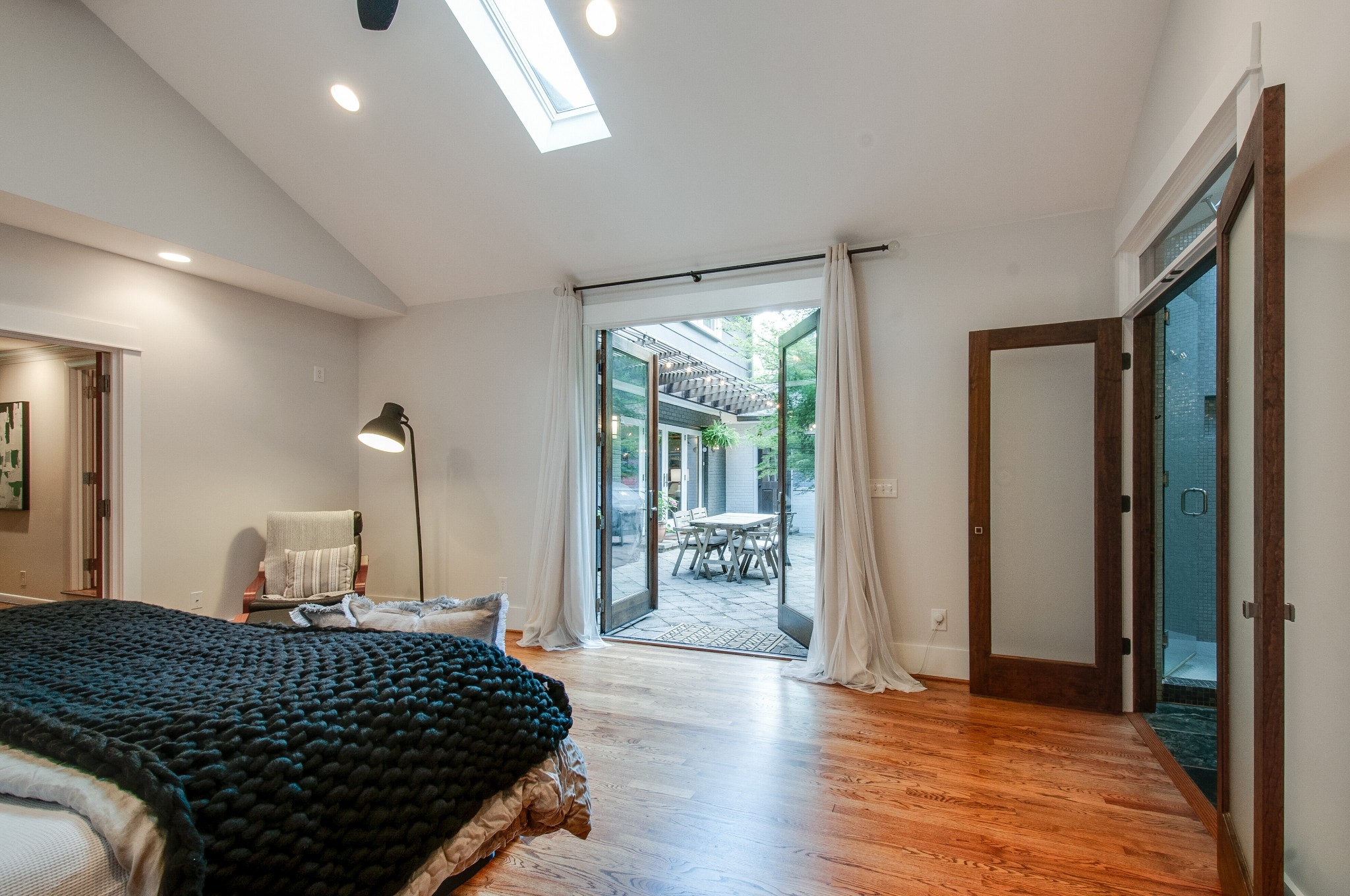 751 Rodney Drive Nashville, TN 37205 - Photo 20 of 50 a bedroom with a bed and wooden floor