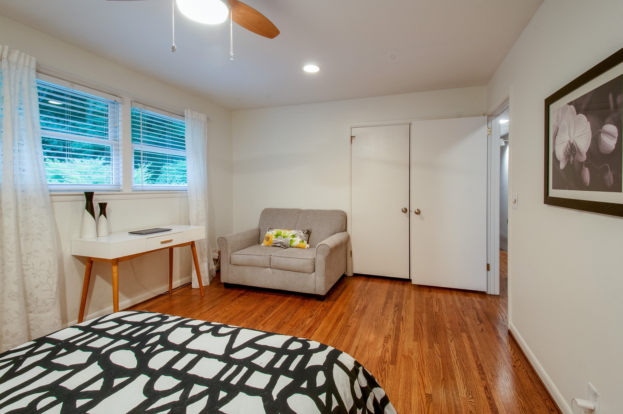 751 Rodney Drive Nashville, TN 37205 - Photo 38 of 50 a bedroom with a bed and wooden floor