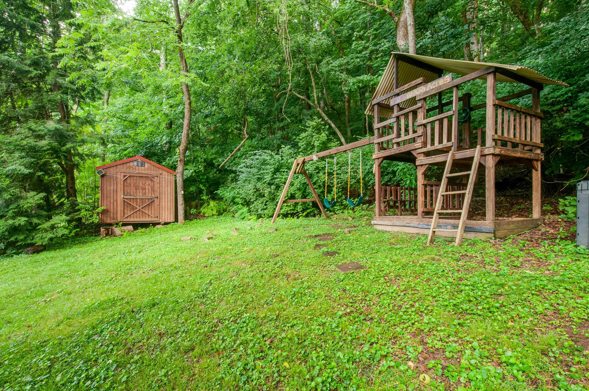 751 Rodney Drive Nashville, TN 37205 - Photo 46 of 50 a front view of a house with a yard and fence