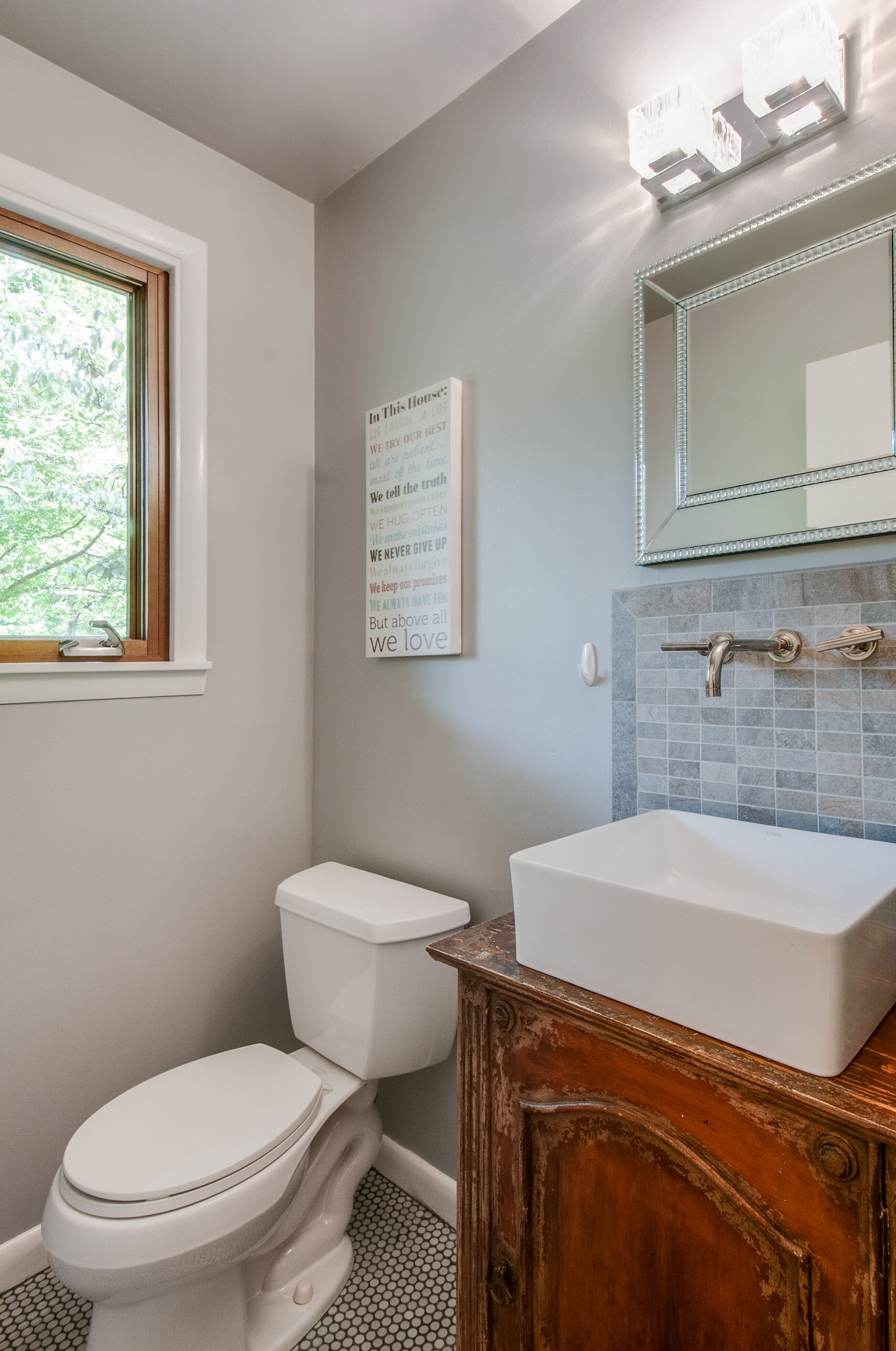 751 Rodney Drive Nashville, TN 37205 - Photo 7 of 50 a bathroom with a sink a toilet and mirror