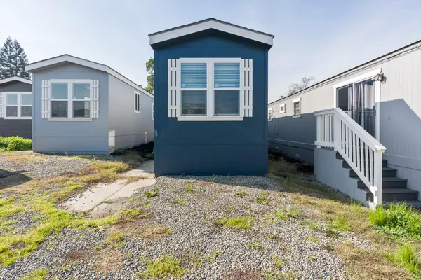 a house with yard in front of it