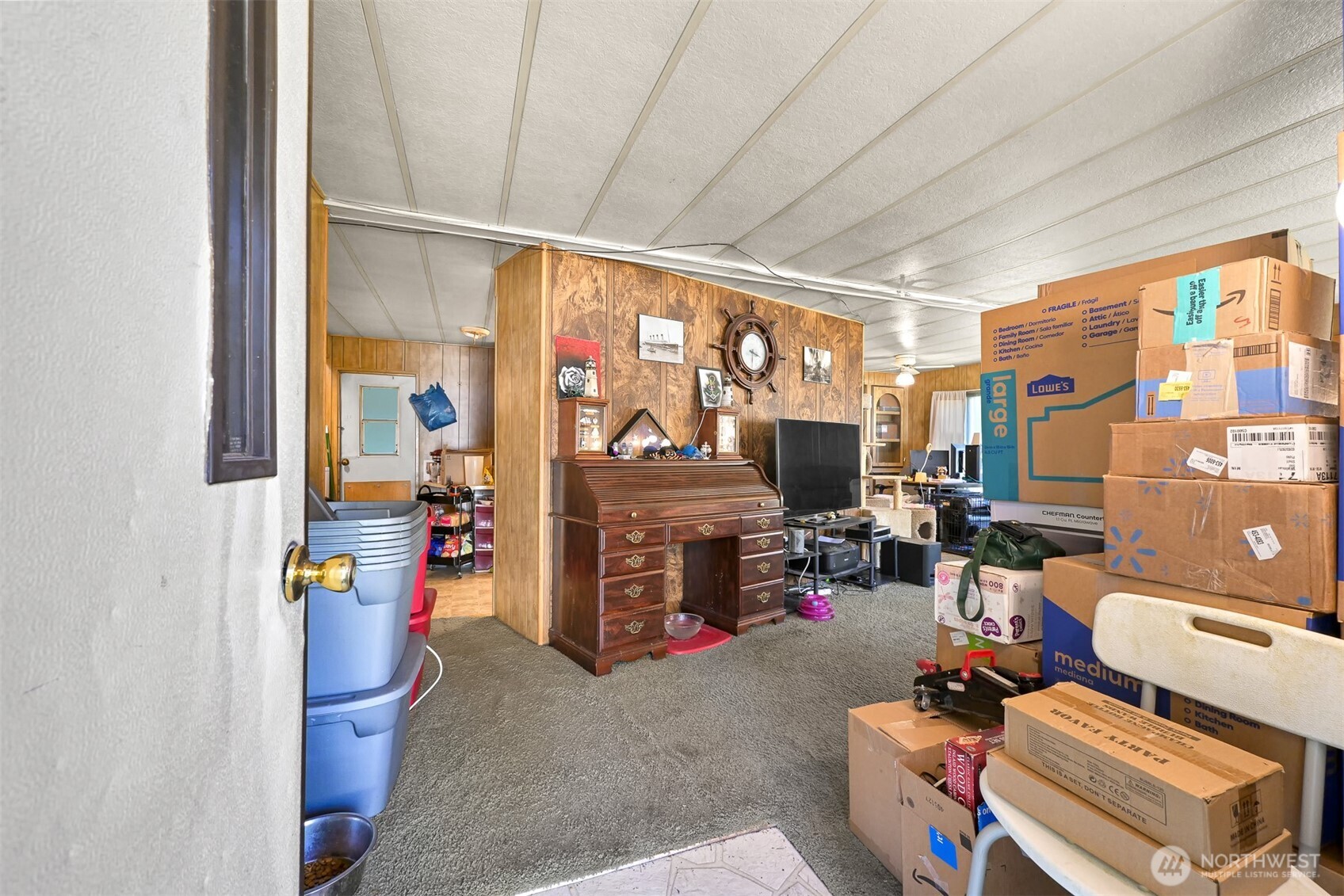 8536 Juniper Place Maple Falls, WA 98266 - Photo 12 of 30 a living room with furniture a fireplace and a flat screen tv