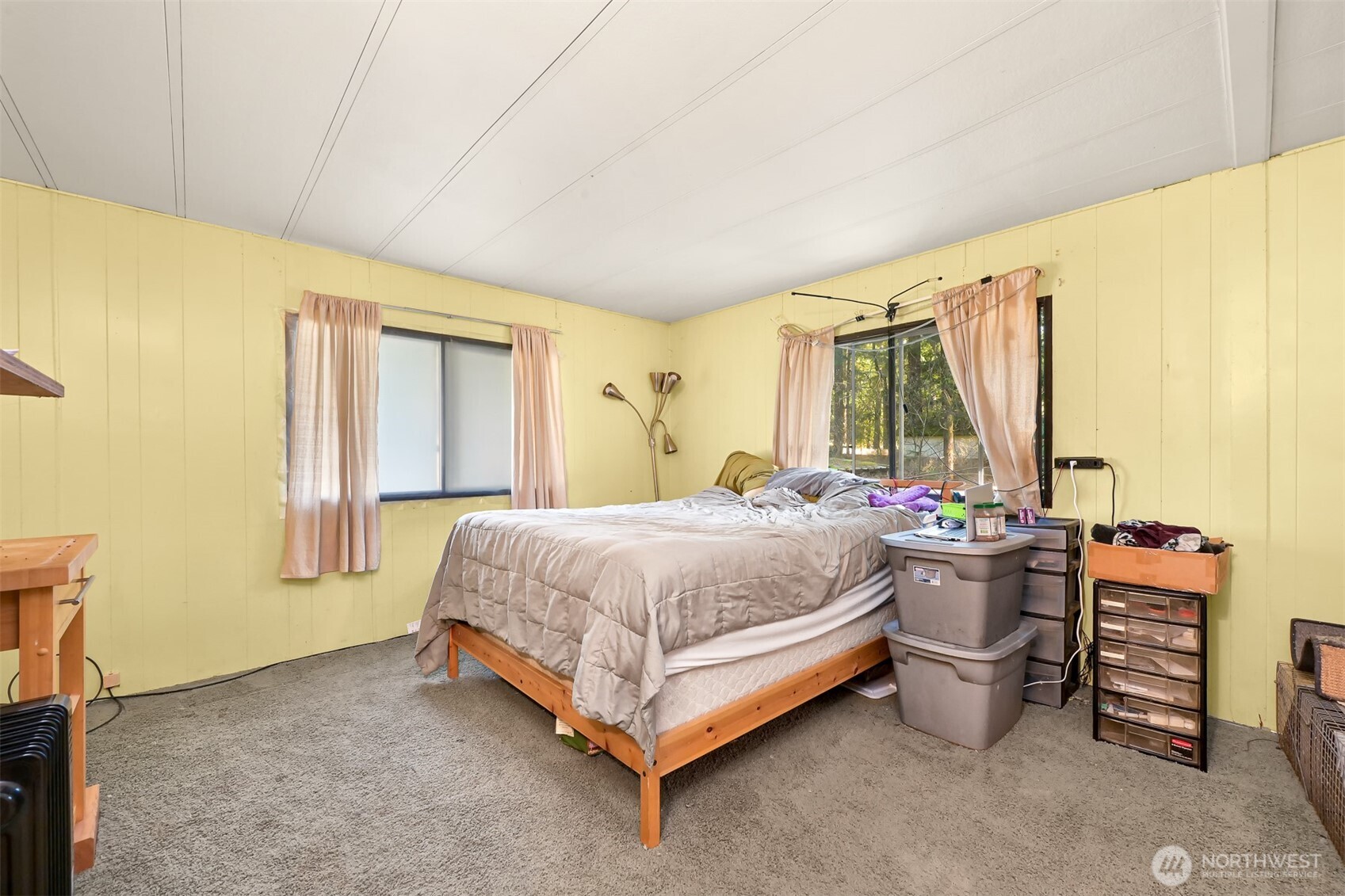 8536 Juniper Place Maple Falls, WA 98266 - Photo 14 of 30 a bed room with a bed and a chair