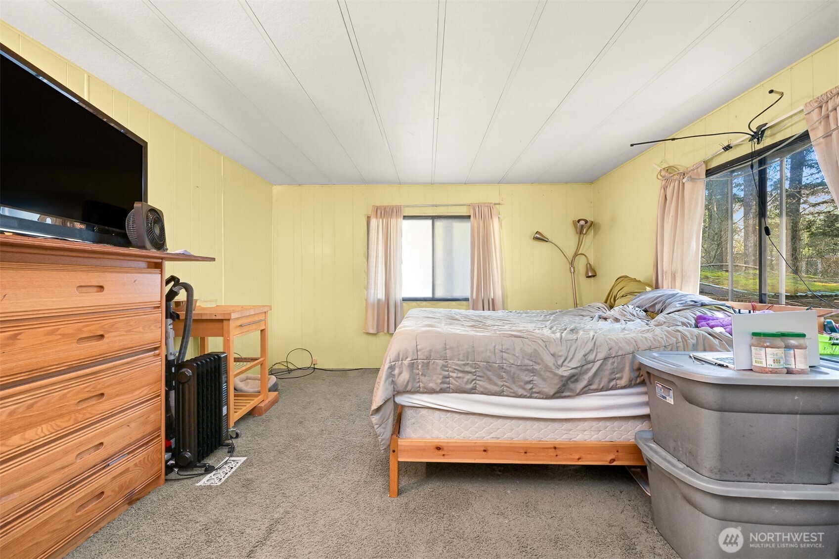 8536 Juniper Place Maple Falls, WA 98266 - Photo 15 of 30 a bedroom with a bed and a flat screen tv