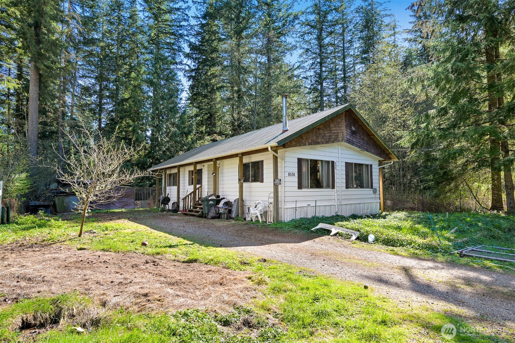 8536 Juniper Place Maple Falls, WA 98266 - Photo 23 of 30 a view of a yard in front of a house with large tree