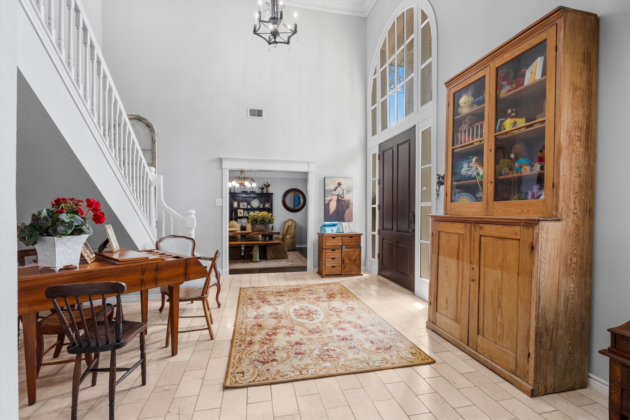 15902 Guinstead Drive Spring, TX 77379 - Photo 7 of 42 Inviting entryway featuring high ceilings and abundant natural light from large windows.