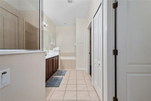 a bathroom with a sink mirror vanity and toilet